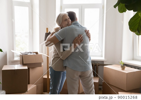 Happy grateful elder wife embracing husband with love 90015268