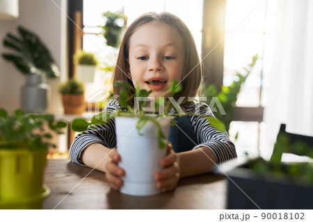 child is caring for plants child is caring for plants 90018102