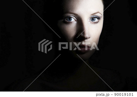 Mysterious portrait of a beautiful young woman Mysterious portrait of a beautiful young woman 90019101
