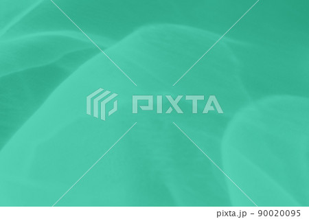 mint colored abstract background with light and shadows caustic effect 90020095