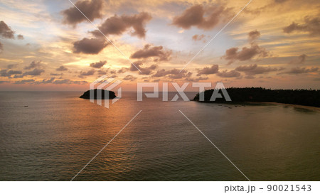 Luxury yacht at sunset with a view of the island. Luxury yacht at sunset with a view of the island. 90021543