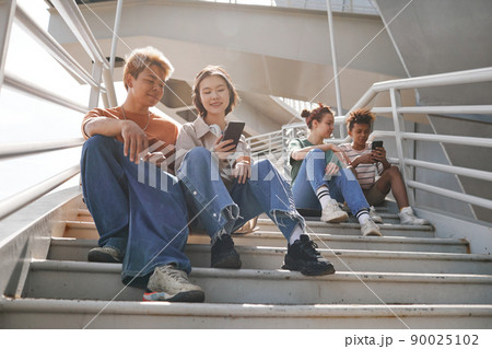 Teens on Stairs in Sunlight Teens on Stairs in Sunlight 90025102