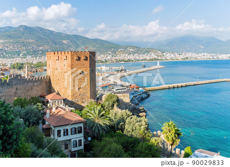 View of Alanya port with the Kizil Kule Red Tower on a sunny day 90029833