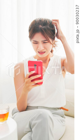 woman online shopping with phone woman online shopping with phone 90030237