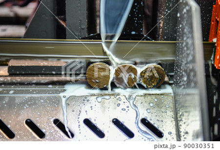 Industrial metal working cutting process The raw material bar clamping on the CNC lathe machine 90030351