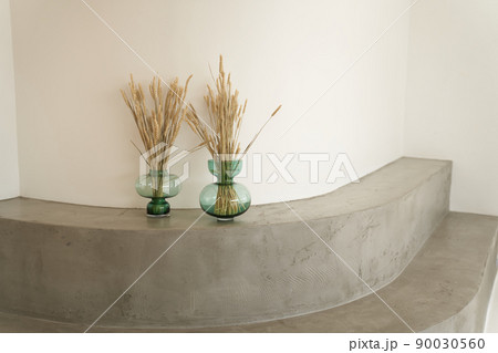 Stone podium with dried flowers for displaying products or cosmetics. Eco trends. Place for text. High quality photo Stone podium with dried flowers for displaying products or cosmetics. Eco trends. Place for text. High quality photo 90030560