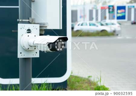 Modern CCTV camera at the entrance to the car park 90032595