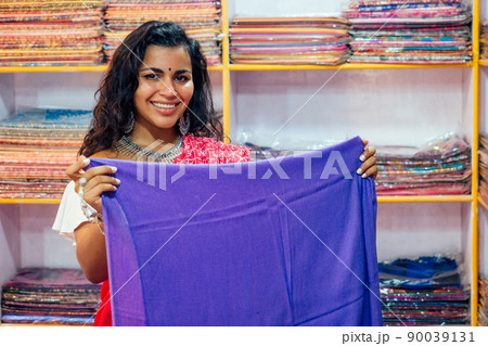 business lady in red traditional sari and jewelery clothes shop owner cashmere yak wool shawls.female seller in goa india arambol sale shop.designer seamstress tailor girl choosing fabric business lady in red traditional sari and jewelery clothes shop owner cashmere yak wool shawls.female seller in goa india arambol sale shop.designer seamstress tailor girl choosing fabric 90039131