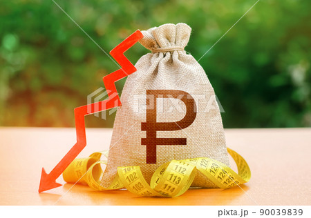 Russian ruble money bag with down arrow and measure tape. Reduced wages, cuts in social benefits. Cutting costs, saving. Decrease in discount rate by national bank. Falling wages and welfare. 90039839