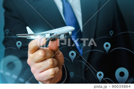 Passenger plane in businessmans hand. Commercial flight management and set new directions. Low cost travel flights. Air traffic communication. Delivery Services. Business trips and tourism. Air miles Passenger plane in businessmans hand. Commercial flight management and set new directions. Low cost travel flights. Air traffic communication. Delivery Services. Business trips and tourism. Air miles 90039864