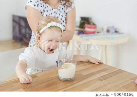 Cochlear implant on baby girl's head. Hearing aid and deafness and diversity concept Cochlear implant on baby girl's head. Hearing aid and deafness and diversity concept 90040166