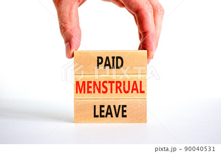 Paid menstrual leave symbol. Concept words Paid menstrual leave on wooden blocks. Beautiful white table white background. Doctor hand. Business medical paid menstrual leave concept. Copy space. Paid menstrual leave symbol. Concept words Paid menstrual leave on wooden blocks. Beautiful white table white background. Doctor hand. Business medical paid menstrual leave concept. Copy space. 90040531