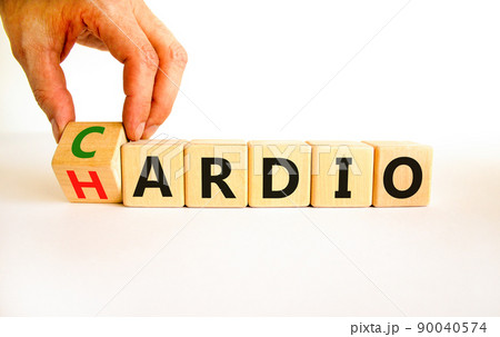 Cardio or hardio symbol. Businessman turns wooden cubes and changes concept words hardio to cardio. Beautiful white background. Sport, healthy lifestyle and cardio or hardio concept. Copy space. 90040574