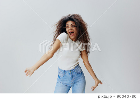 GOOD OFFER. Shocked excited happy pretty Latin female with waving afro hair, spreading hands, say Yeah, looking aside, stay isolated over white background. Copy space, free place, fashion banner GOOD OFFER. Shocked excited happy pretty Latin female with waving afro hair, spreading hands, say Yeah, looking aside, stay isolated over white background. Copy space, free place, fashion banner 90040780