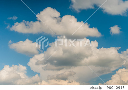 White clouds against blue sky 90040913