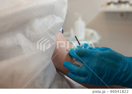 Young woman in blood transfusion concept hand. 90041822