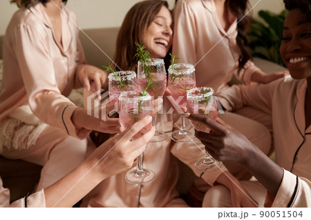 Friends Toasting with Beautiful Cocktails 90051504