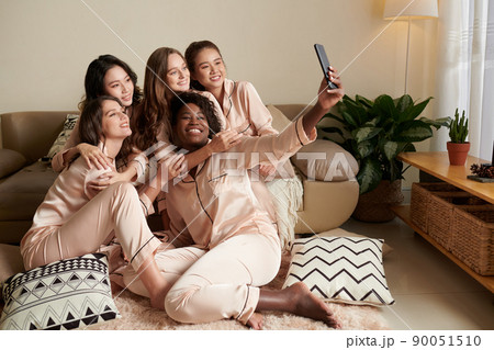 Woman Filming Video with Friends 90051510