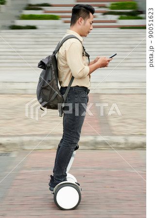 Student Riding on E-scooter Student Riding on E-scooter 90051623