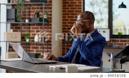 Company specialist analyzing online statistics on website, using internet report to write email on laptop. Office worker planning startup project presentation with paperwork app. Tripod shot. Company specialist analyzing online statistics on website, using internet report to write email on laptop. Office worker planning startup project presentation with paperwork app. Tripod shot. 90058108