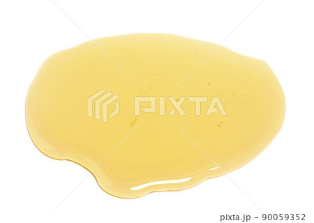 Puddle of honey isolated over white background. Puddle of honey isolated over white background. 90059352
