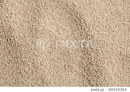 Active dry baking yeast granules background texture, top view Active dry baking yeast granules background texture, top view 90059364