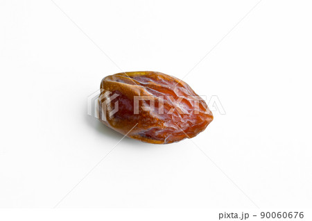 Organic fresh nutritious dried hurma dates medjool grains, on a white background Organic fresh nutritious dried hurma dates medjool grains, on a white background 90060676