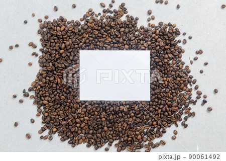 Close-up view of coffee beans and empty paper 90061492