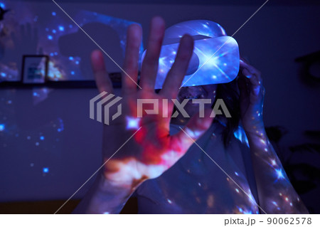 Woman is using virtual reality headset. Elements of this image furnished by NASA. Woman is using virtual reality headset. Elements of this image furnished by NASA. 90062578