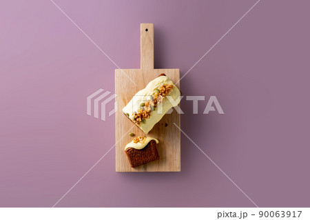 Sliced carrot cake on cutting board. Sliced carrot cake on cutting board. 90063917