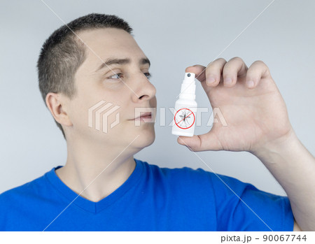 Mosquito repellent. Close-up of an insect repellant spray. Means for repulsion of blood-sucking parasites. Concept photo Mosquito repellent. Close-up of an insect repellant spray. Means for repulsion of blood-sucking parasites. Concept photo 90067744