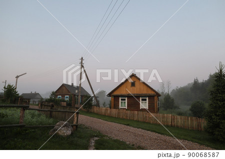 summer picturesque rural landscape with a wooden country farmhouse summer picturesque rural landscape with a wooden country farmhouse 90068587