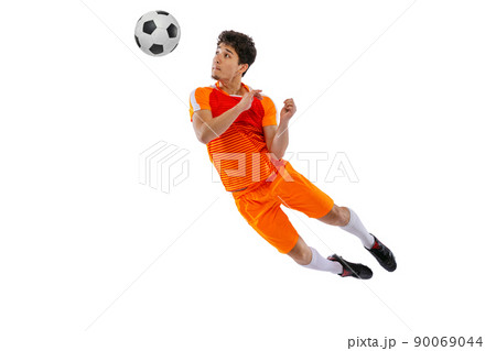 Professional football, soccer player in motion isolated on white studio background. Concept of sport, match, active lifestyle, goal and hobby 90069044