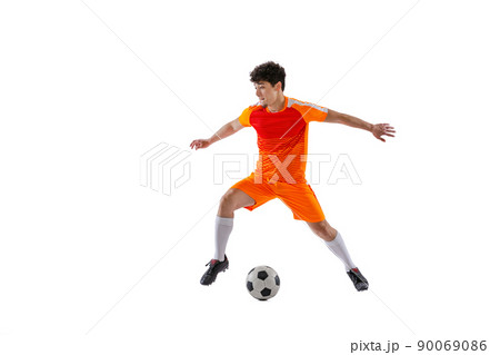 Professional football, soccer player in motion isolated on white studio background. Concept of sport, match, active lifestyle, goal and hobby 90069086