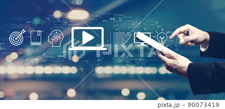 Webinar concept with businessman using a tablet 90073419