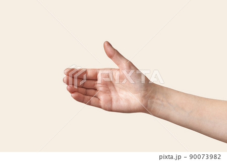 Reaching female hand isolated on white Reaching female hand isolated on white 90073982