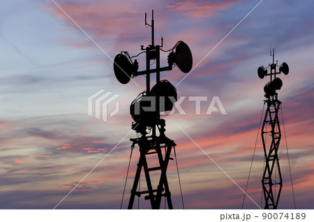 Air defense radars of military mobile anti aircraft systems, modern army industry on the background of the sunset orange sky, Russia 90074189