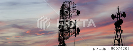Air defense radars of military mobile anti aircraft systems, modern army industry on the background of the sunset orange sky, Russia Air defense radars of military mobile anti aircraft systems, modern army industry on the background of the sunset orange sky, Russia 90074202