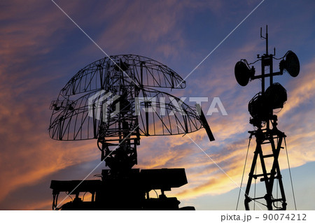 Air defense radars of military mobile anti aircraft systems, modern army industry on the background of the sunset orange sky, Russia 90074212