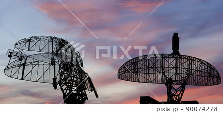 Air defense radars of military mobile anti aircraft systems, modern army industry on the background of the sunset orange sky, Russia Air defense radars of military mobile anti aircraft systems, modern army industry on the background of the sunset orange sky, Russia 90074278