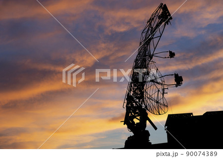Air defense radars of military mobile anti aircraft systems, modern army industry on the background of the sunset orange sky, Russia Air defense radars of military mobile anti aircraft systems, modern army industry on the background of the sunset orange sky, Russia 90074389