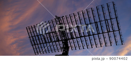 Air defense radars of military mobile anti aircraft systems, modern army industry on the background of the sunset orange sky, Russia Air defense radars of military mobile anti aircraft systems, modern army industry on the background of the sunset orange sky, Russia 90074402