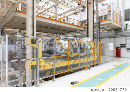 Photo of automobile production line. Welding car body. Modern car assembly plant. Auto industry Photo of automobile production line. Welding car body. Modern car assembly plant. Auto industry 90074779