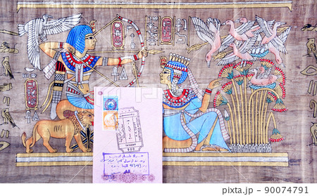 Page of the passport with the visa Egypt Hurghada International Airport on the background of the papyrus 90074791