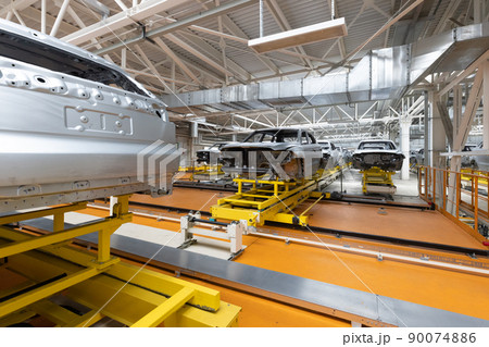 Car bodies are on assembly line. Factory for production of cars. Modern automotive industry. A car 90074886