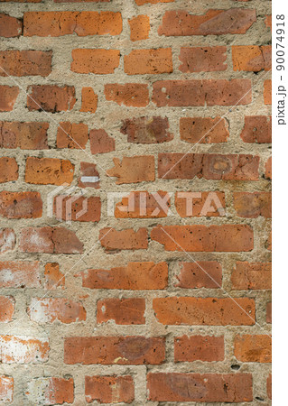 Brick red wall. Background of a old brick house. Brick red wall. Background of a old brick house. 90074918