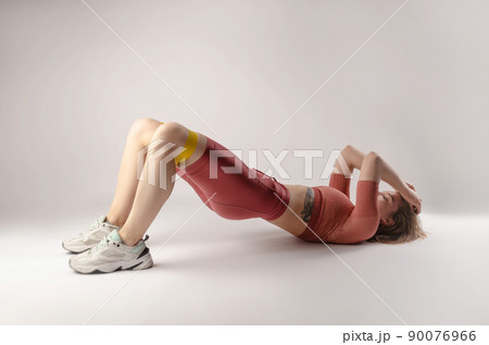 athletic girl posing in the Studio on a white background athletic girl posing in the Studio on a white background 90076966
