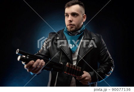 guy in a leather jacket with a shotgun guy in a leather jacket with a shotgun 90077136