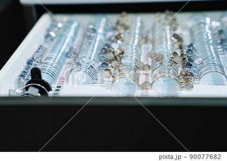 box with a set of test spectacle lenses for the examination. ophthalmologist box with a set of test spectacle lenses for the examination. ophthalmologist 90077682