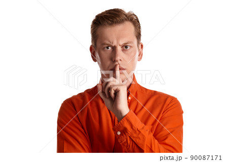 Close-up portrait of a ginger guy in orange shirt posing isolated on white background. Sincere emotions. Close-up portrait of a ginger guy in orange shirt posing isolated on white background. Sincere emotions. 90087171